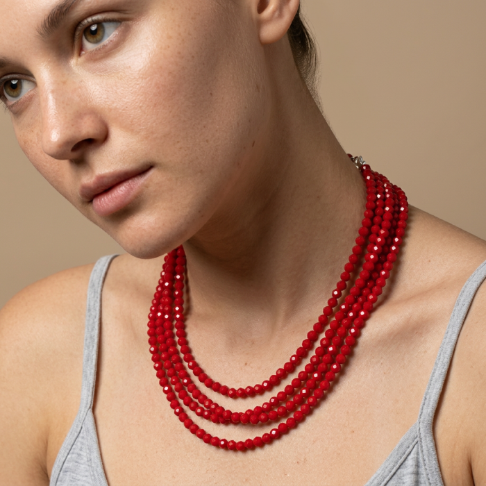 ESTANCIA Sublime natural Red Fossilized Coral Sterling Silver handmade Necklace - Side view of multi-strand red coral necklace worn on model.