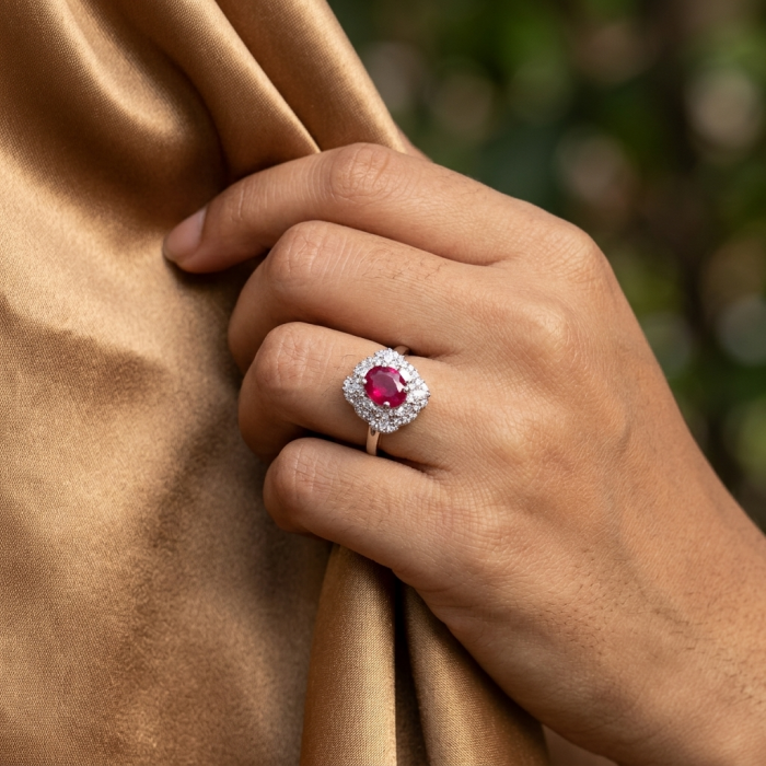 Authentic Ruby .925 Sterling Silver brilliantly handcrafted ring s. 6 3/4 - Ruby ring worn on hand, close-up with gold fabric background.
