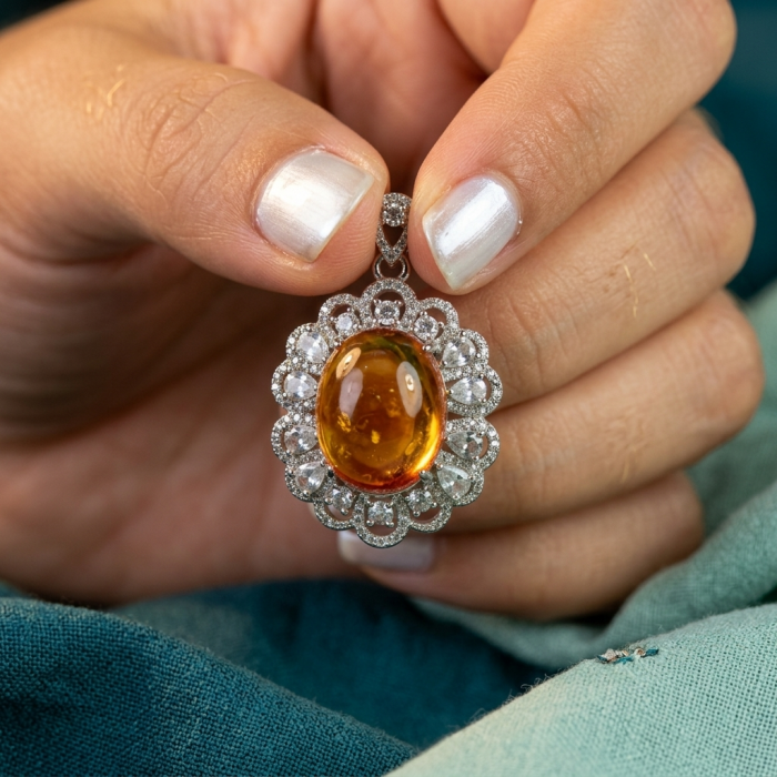 Emily Luxury genuine 18.5 CARAT Golden Topaz .925 Sterling Silver handmade Pendant - Close-up of hand holding Emily luxury golden topaz pendant.