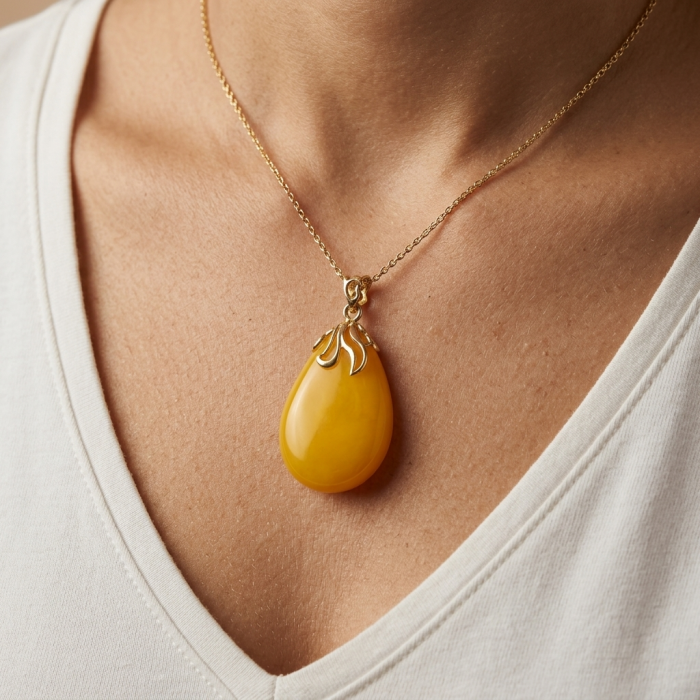 Sea Treasure Prehistoric Authentic Butterscotch Baltic Amber 18k Gold over .925 Sterling Silver beautifully handcrafted Pendant - Amber pendant worn on neck, front view.