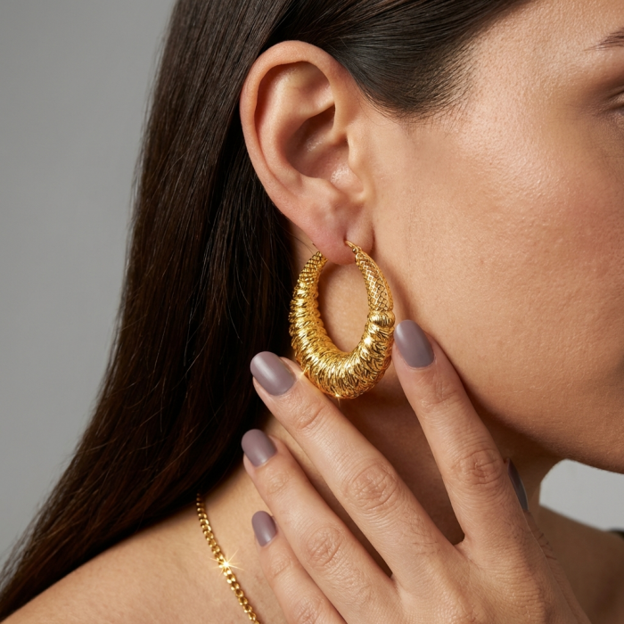 Black Label Collection - Dubai Style - Natural 22K Gold over .925 Sterling Silver handmade LARGE hoop earrings - Side view of gold hoop earring worn on ear, hand touching earring.