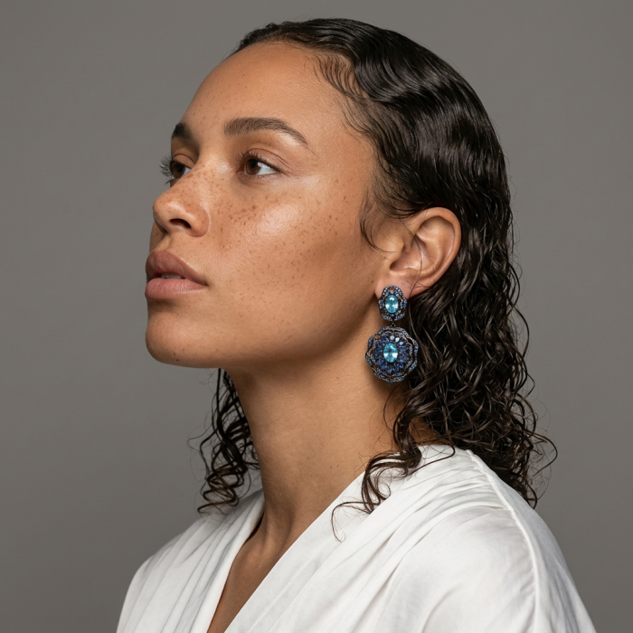 Atlantica 4.7 carat Swiss Blue Topaz .925 Sterling Silver dipped in black rhodium Handcrafted Statement earrings - Side view of woman wearing Atlantica Swiss Blue Topaz earrings