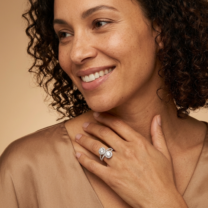 Aphrodite - 3.6 carat White Topaz .925 Sterling Silver handcrafted ring size 7 1/4 - Woman wearing Aphrodite ring, showcasing white topaz stones on hand