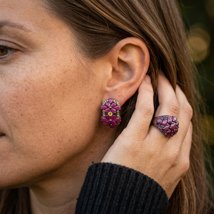 Bella Rosa Genuine 22.8 carat Ruby .925 Sterling Silver dipped in black rhodium Statement brilliantly handcrafted earrings - Side view: woman wearing Bella Rosa Ruby earrings and ring.