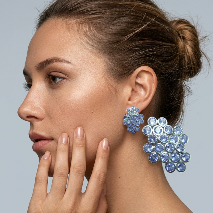 Giovanna - Authentic 17.9 carat Tanzanite .925 Sterling Silver handcrafted earrings - Side view of woman wearing Giovanna Tanzanite earrings.