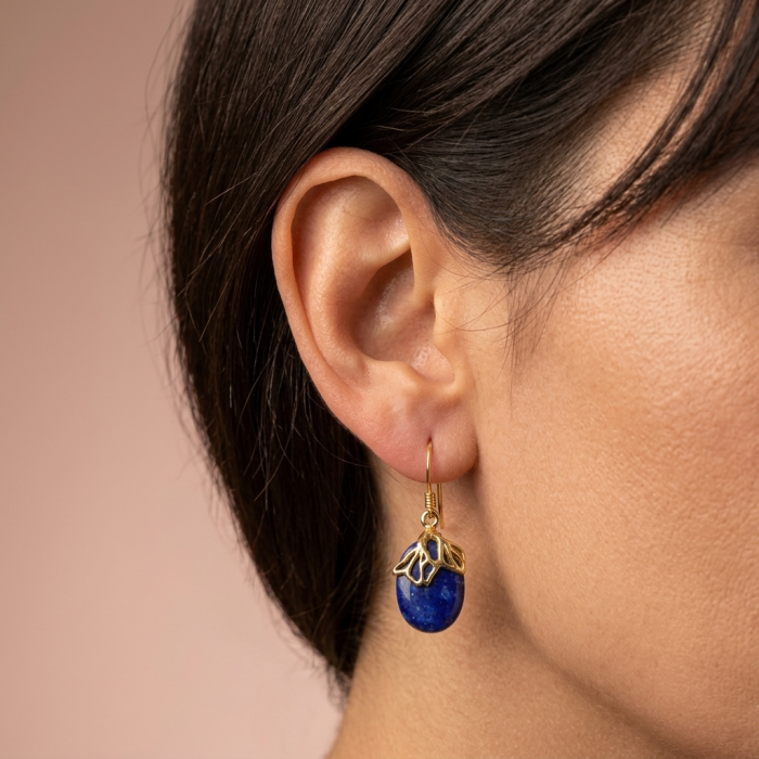 Perfect genuine Blue Lapis Lazuli .925 Sterling Silver dipped in 14K Gold handmade earrings - Earring with blue lapis lazuli stone worn on ear, side view.