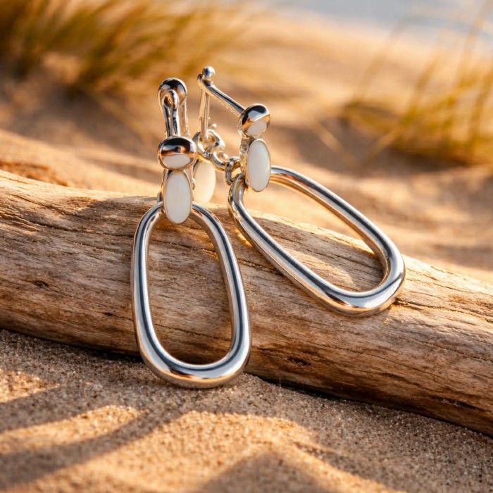 Modern design Blister Pearl .925 Sterling Silver handmade Bali made Earrings - Modern sterling silver earrings with pearl, displayed on driftwood.