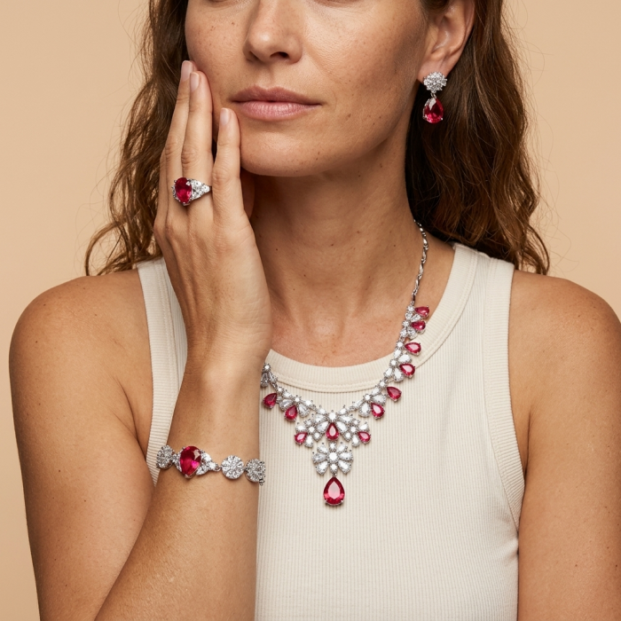 Giovanna - Magnificent Jewel 7.2 carat Ruby .925 Sterling Silver handcrafted incredible Statement Bracelet - Woman wearing Giovanna ruby necklace, earrings, ring, and bracelet set.