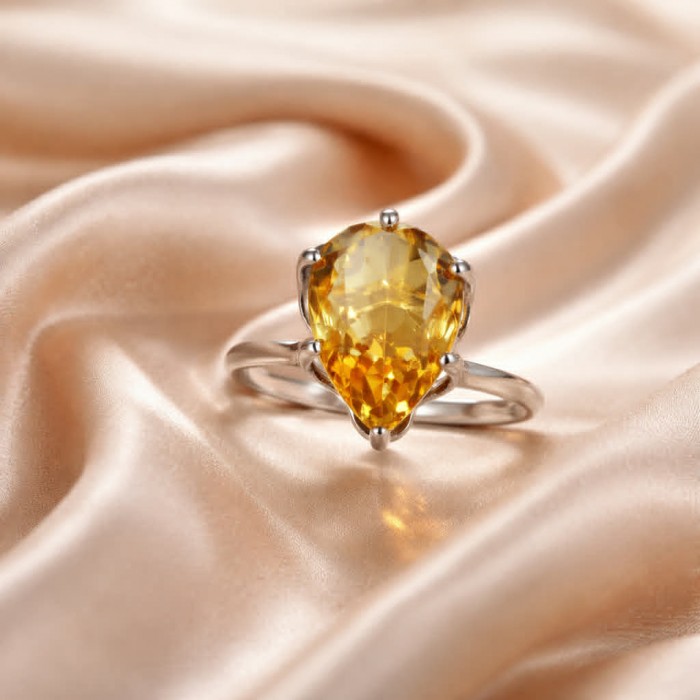 Solid 11.8 carat Genuine Lemon Quartz .925 Sterling Silver handcrafted ring size 7 - Close-up of lemon quartz ring on silk background