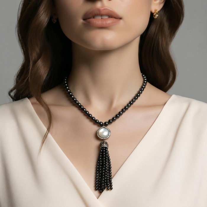 Boho Style Genuine Titanum Crystal .925 Sterling Silver handmade necklace 34 inches long - Woman wearing Boho style necklace with tassel detail, close-up view.