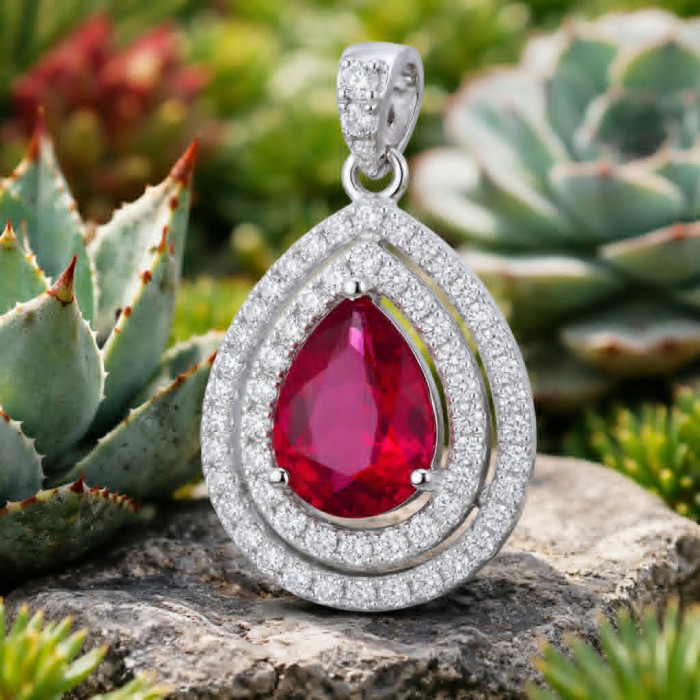 Heirloom Genuine 4.5 carat Ruby .925 Sterling Silver handmade Pendant - Close-up of Heirloom Ruby pendant in sterling silver, succulent background.