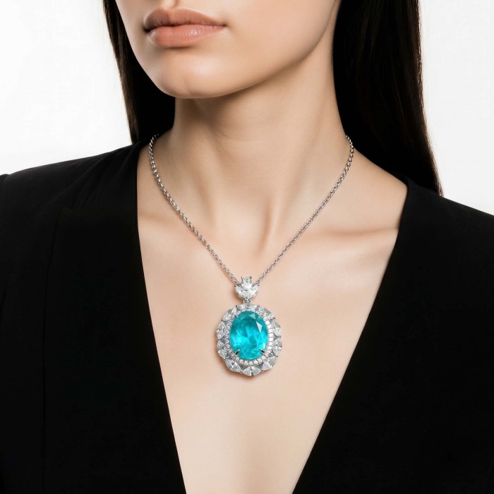 Wonderland 15.8 carat classic oval cut Paraiba Tourmaline .925 Sterling Silver Handcrafted Statement necklace - Model wearing Wonderland oval Paraiba Tourmaline necklace, front view.