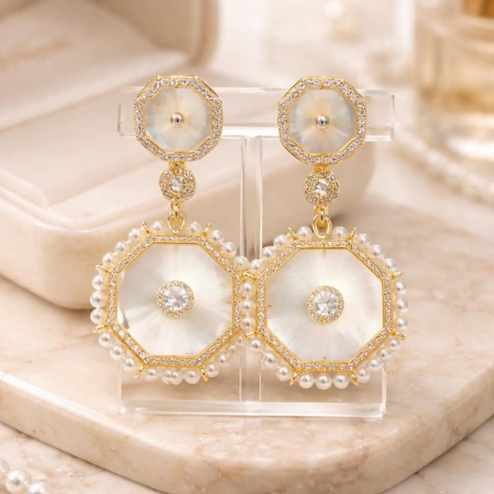 Large - Sublime Blister Pearl White Sapphire 18K Gold over .925 Sterling Silver handcrafted Earrings - Front view of octagonal pearl and sapphire drop earrings on stand.