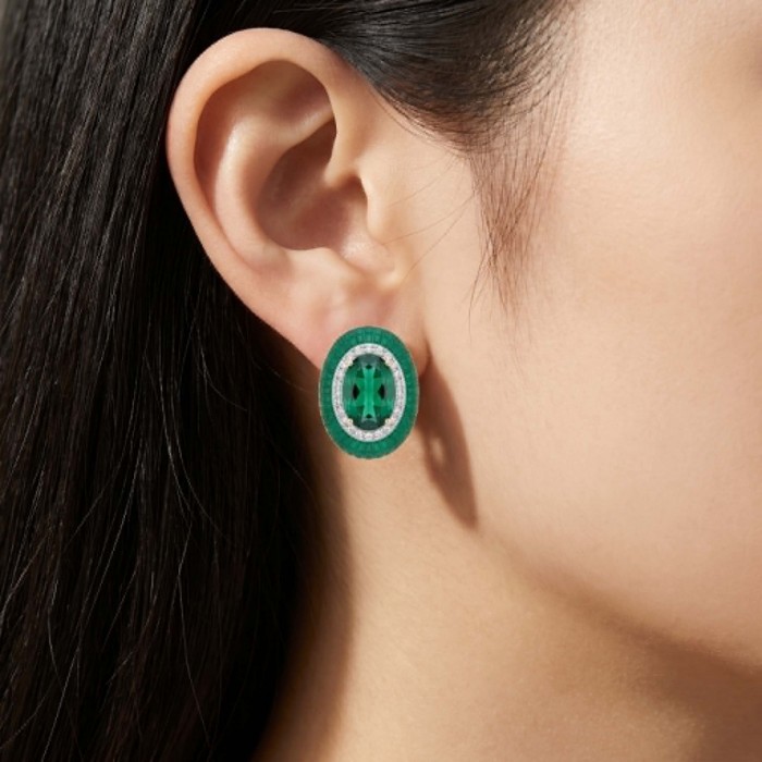 Julietta 12.5 carat Colombian Emerald .925 Sterling Silver handmade Statement earrings - Side view of Julietta emerald earring worn on ear.