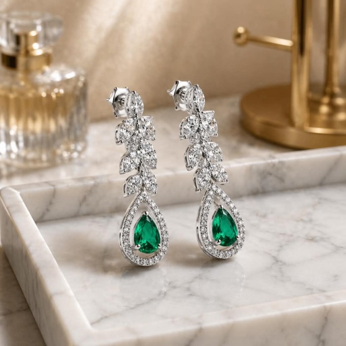 Gabriella 6.7 carat authentic Emerald rhodium over .925 Sterling Silver handcrafted Statement earrings - Elegant drop earrings with emerald and diamonds on marble tray.