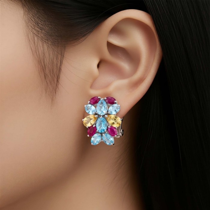 Dolce Vita 29.7 carat Swiss Blue Topaz rhodium over .925 Sterling Silver Handcrafted Statement earrings - Earrings with blue, yellow, and red stones worn on ear.