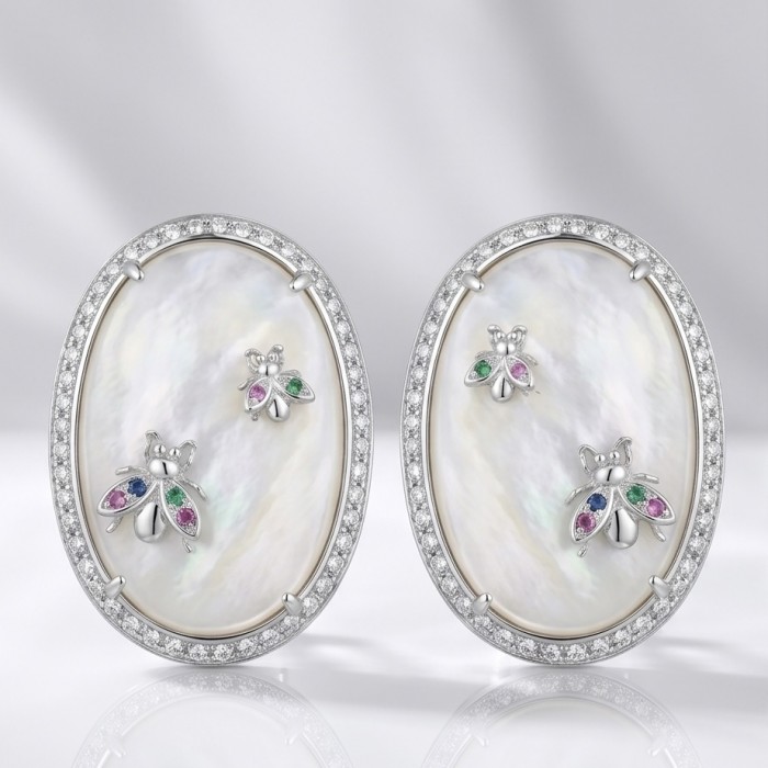 Genuine Blister Pearl lab grown Diamond rhodium over .925 Sterling Silver handcrafted Large Statement Earrings - Oval earrings with blister pearl and diamond, front view.