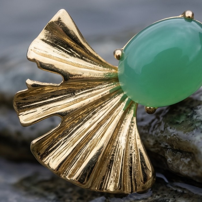Unique genuine 8.5 carat Jade 18K Gold over over .925 Sterling Silver handcrafted earrings - Close-up of jade and gold flower brooch with textured petal details.