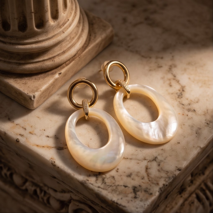 Genuine Blister Pearl 18K Gold over .925 Sterling Silver handcrafted Large Statement Earrings - Gold and pearl earrings on marble surface, top view.
