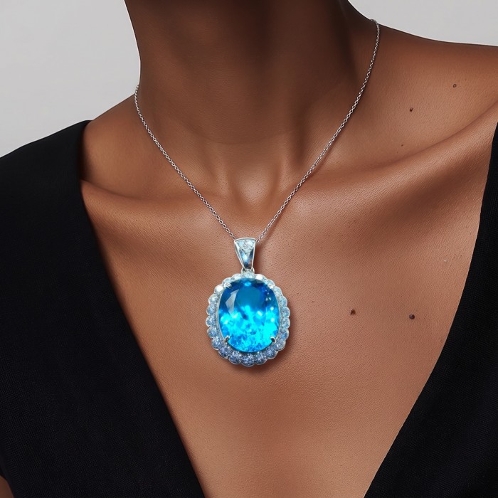 Tiffany Incredible oval cut 45.4 carat Swiss Blue Topaz rhodium over .925 Sterling Silver handcrafted pendant - Worn on neck: Tiffany Swiss Blue Topaz oval pendant on silver chain