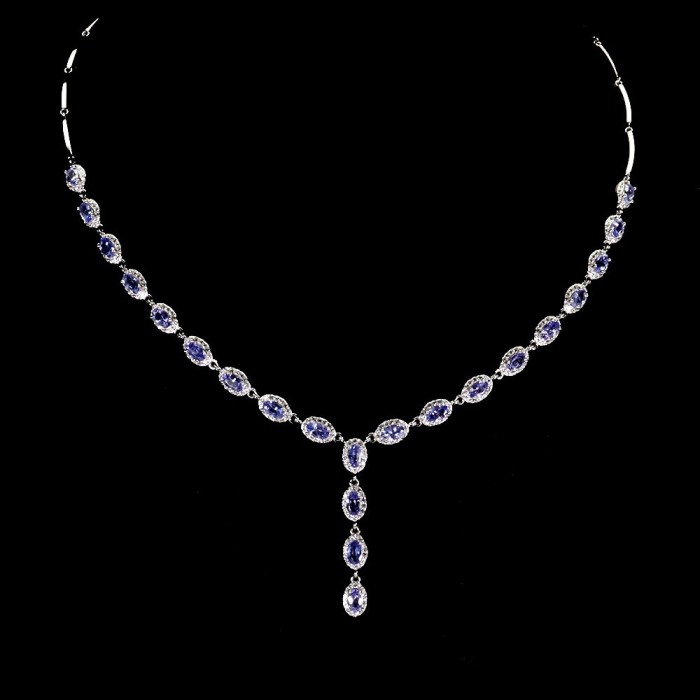 Luxurious 12.2 carat Genuine Tanzanite .925 Sterling Silver handmade Necklace - Tanzanite necklace on black background, full view.