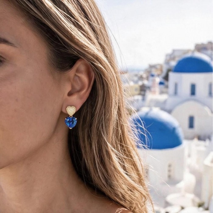 Tranquillity - 8.7 carat carved Swiss Blue Topaz .925 Sterling Silver dipped in Rhodium Handcrafted Statement earrings - Side view of earrings with 8.7 carat Swiss Blue Topaz worn in Santorini.