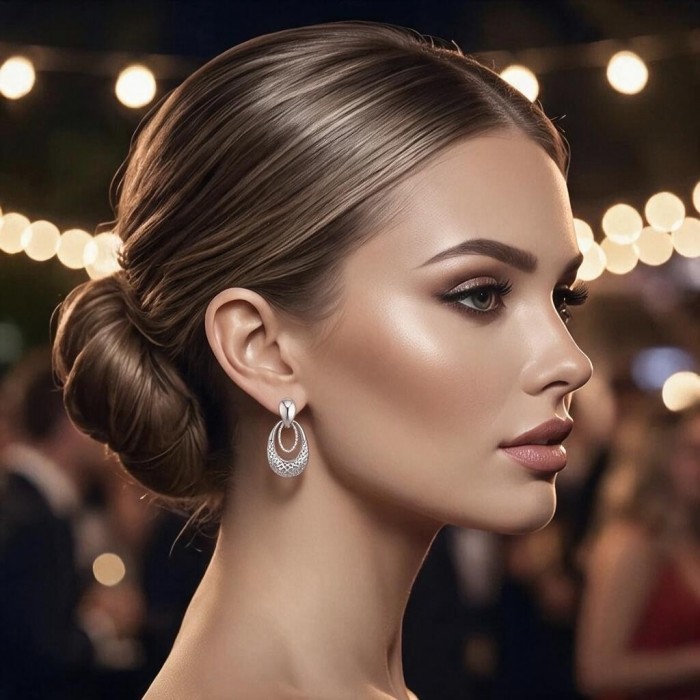 Highly Polished Fancy design 3.2 carat White Topaz .925 Sterling Silver Italy made Earrings - Side view of polished earrings with white topaz, worn by a model.