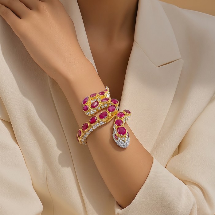 Huge Snake Genuine 37.9 carat Ruby 22K Gold over .925 Sterling Silver handcrafted Hinged Bangle Bracelet - Snake design bracelet with rubies worn on wrist, cream background