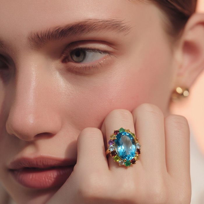 The Ocean Empress 55.8 carat Swiss Blue Topaz 22K Gold over .925 Sterling Silver dipped in rhodium handcrafted ring size 8 - Close-up of The Ocean Empress ring worn on hand, highlighting the stone.