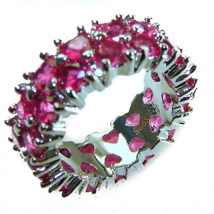 Born to Glam authentic Garnet .925 Silver handcrafted Eternity Ring s. 6 - Close-up of garnet and silver eternity ring with heart details.