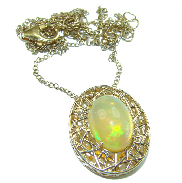 Earth Treasure Authentic 16.8 carat Golden Ethiopian Opal 22K Gold over .925 Sterling Silver handcrafted Statament Necklace - Oval opal pendant with intricate pattern and chain folded above