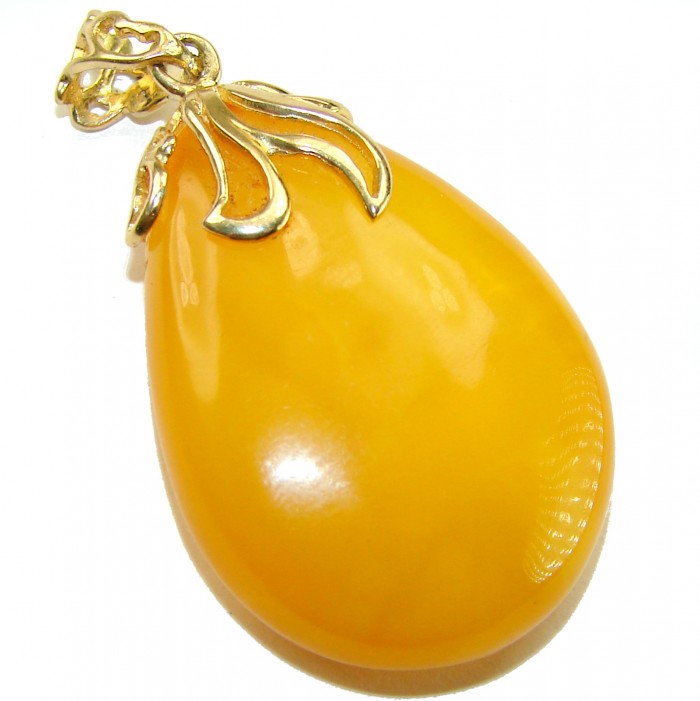 Sea Treasure Prehistoric Authentic Butterscotch Baltic Amber 18k Gold over .925 Sterling Silver beautifully handcrafted Pendant - Close-up of butterscotch Baltic amber pendant with gold detailing.