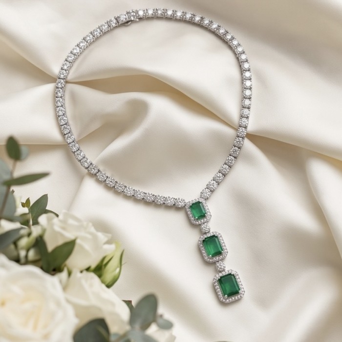 Ofelia - Authentic 10.5 CARAT natural Colombian Emerald .925 Sterling Silver handcrafted necklace - Necklace with Colombian emeralds on satin backdrop, front view.