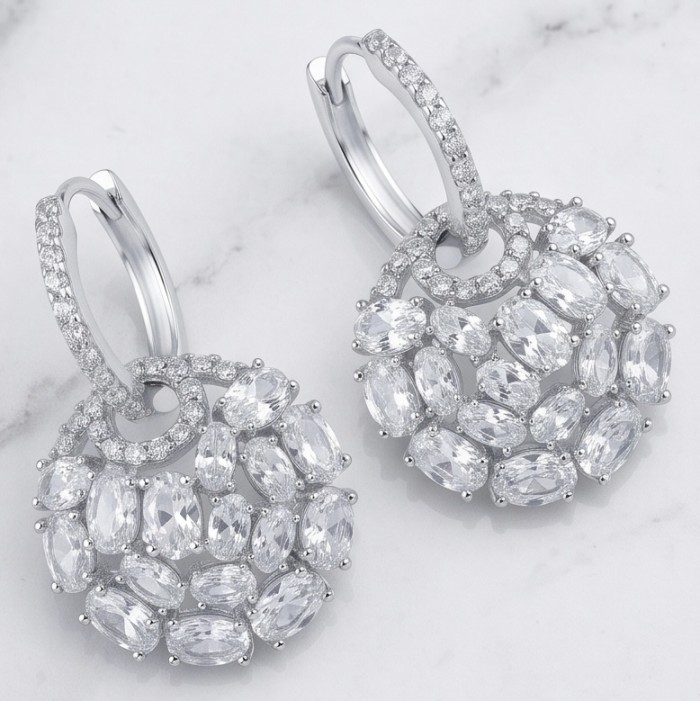 Elizabeth Natural 12.2 carat Moissanite .925 Sterling Silver handcrafted earrings - Front view of Elizabeth moissanite earrings on a marble background.