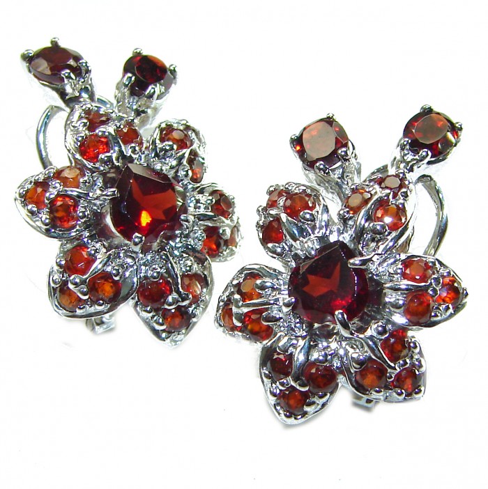 Penelope Authentic 22.5 carat faceted Garnet .925 Sterling Silver handcrafted earrings - Garnet and sterling silver earrings front view, flower design.