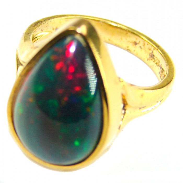 A COSMIC POWER Genuine 14.2 carat Black Opal 18K Gold over .925 Sterling Silver handmade Ring size 7 1/2 - Close-up of black opal ring set in 18K gold, side view.
