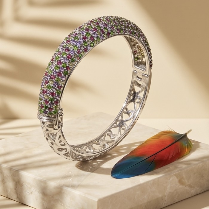 Fiesta Authentic 33.2 carat Multigem .925 Sterling Silver handmade bangle Bracelet - Fiesta bracelet side view on marble with colorful feather decor