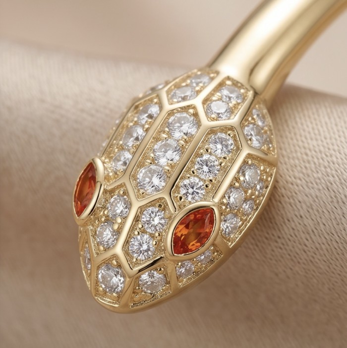 Precious Boa Snake Genuine 0.7 carat orange Sapphire .925 Sterling Silver dipped in 14K Gold handcrafted Bracelet - Close-up of snake head detail with orange sapphires and diamonds