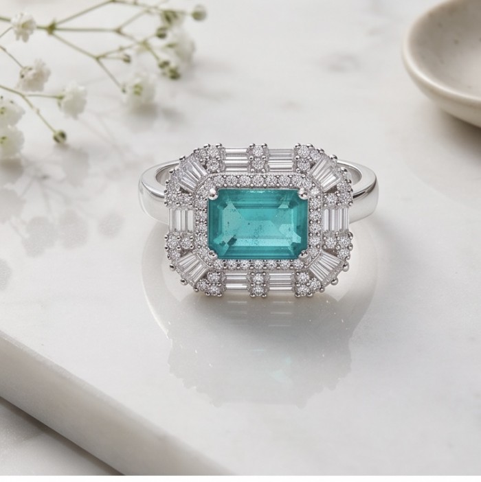 Elizabeth 5.2 carat Colombian Emerald .925 Sterling Silver dipped in Rhodium handcrafted Ring size 8 - Close-up of Elizabeth Colombian Emerald ring on marble surface.