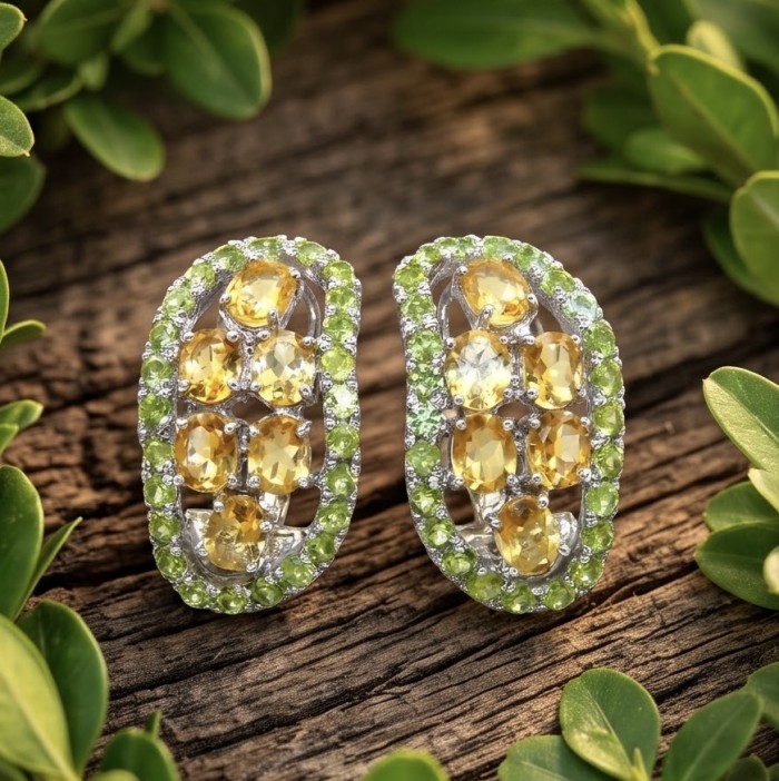 Giovanna - Authentic 12.9 carat Brazilian Citrine .925 Sterling Silver dipped in rhodium handcrafted earrings - Citrine earrings on wood, top view, green accent stones.