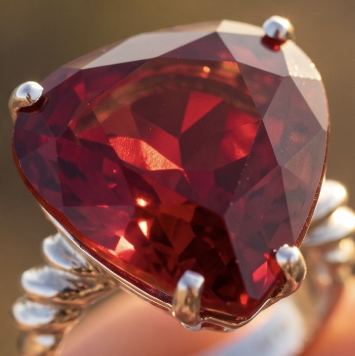 25.6 ctw Red Topaz .925 Sterling Silver handcrafted Statement Ring size 6 - Close-up of red topaz ring in sterling silver with prong setting.
