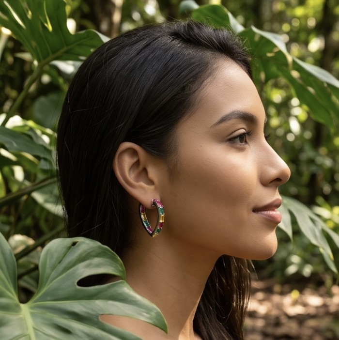 Luxurious 6.9 carat authentic Multigem .925 Sterling Silver dipped in Rhodium Handcrafted Statement Earrings - Side view: Multigem hoop earring worn on model in nature setting.