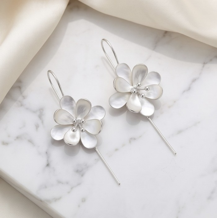 Silver Flowers Italy made .925 Sterling Silver Earrings - Top view of silver flower .925 sterling earrings on marble background.