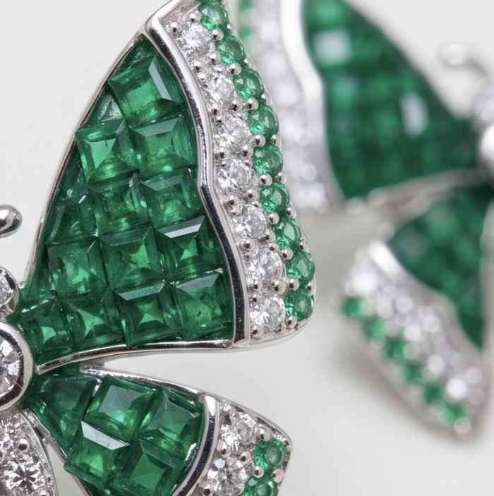 Incredible green Butterflies genuine mysery setting 11.5 CARAT Emerald .925 Sterling Silver handcrafted Earrings - Stone close-up of butterfly-shaped jewelry with emeralds and diamonds