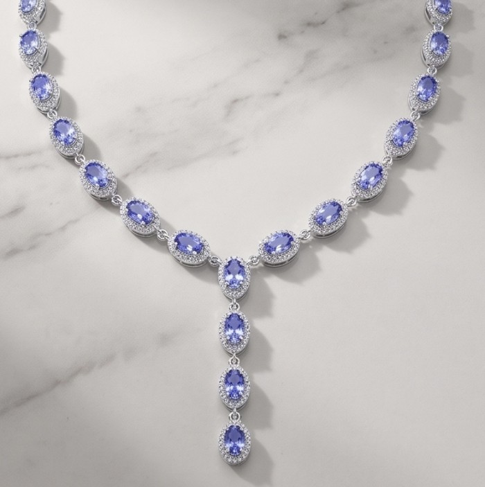 Luxurious 12.2 carat Genuine Tanzanite .925 Sterling Silver handmade Necklace - Tanzanite necklace on display, showcasing gemstone details.