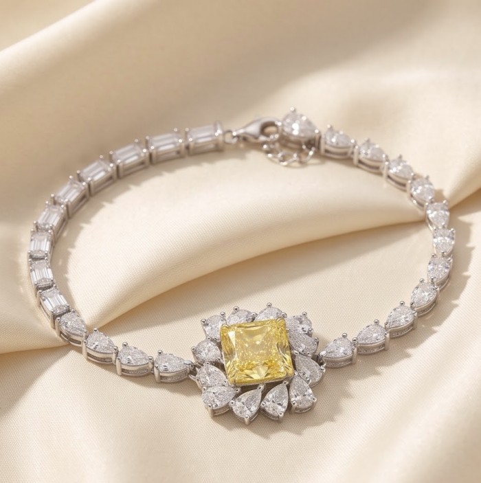 Luxurious 7.5 carat princess cut Yellow Sapphire .925 Sterling Silver handcrafted Statement Bracelet - Close-up of bracelet with yellow sapphire and diamond accents on satin fabric