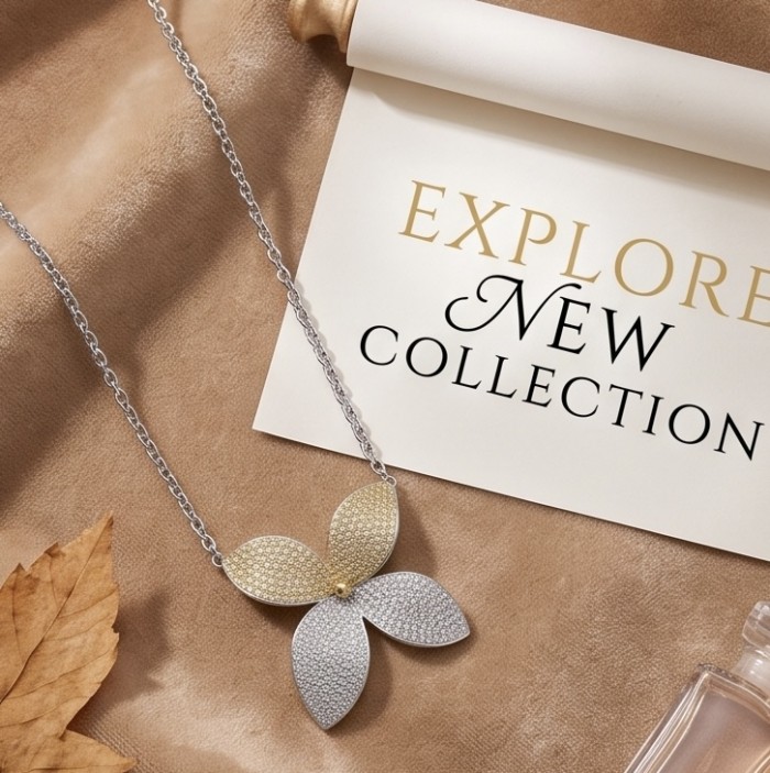 Precious Leaves 4.2 carat pave White Golden Topaz .925 Sterling Silver Handcrafted Necklace - Precious Leaves necklace on display with "Explore New Collection" backdrop