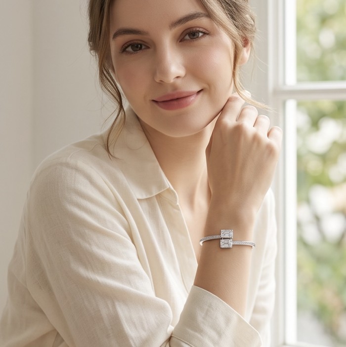 Precious Light Natural 12.2 carat Moissonite .925 Sterling Silver dipped in rhodium bracelet - Model wearing bracelet by window, showcasing moissanite detail.