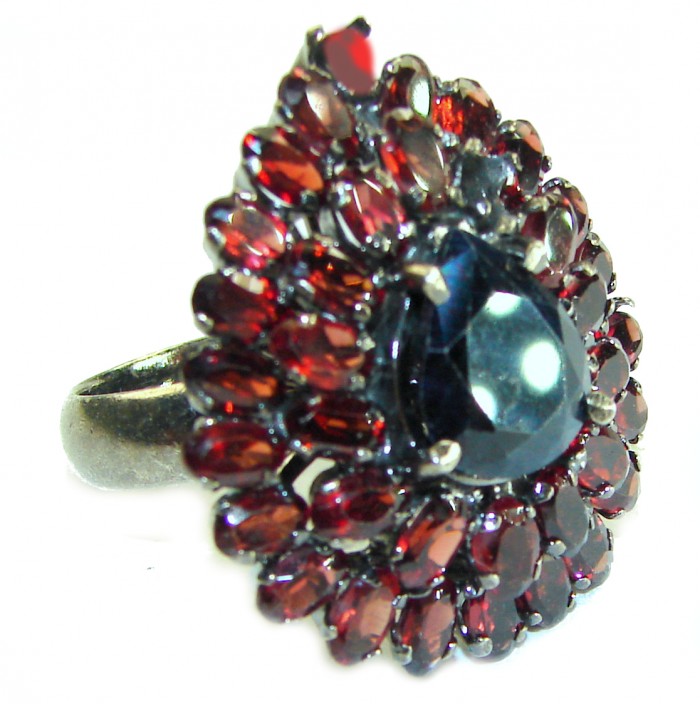 Blue Odyssey 22.5 carat authentic Sapphire black rhodium over .925 Silver handcrafted Cocktail Ring s. 8 1/2 - Side view of Blue Odyssey ring with sapphire and red stones.