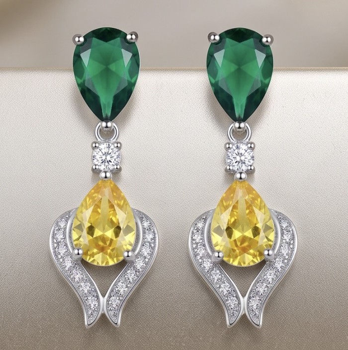 6.8 carat pearl cut Topaz rhodium over .925 Sterling Silver Handcrafted Statement earrings - Front view of emerald and topaz drop earrings on display.